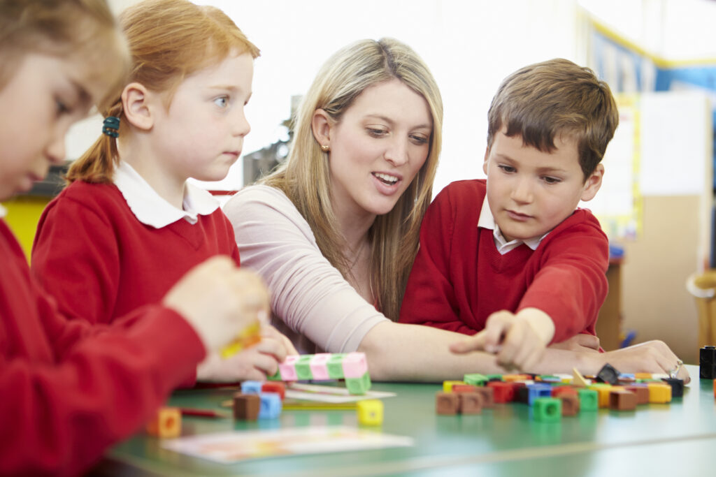 Teaching assistant with primary school children. Early Years Education